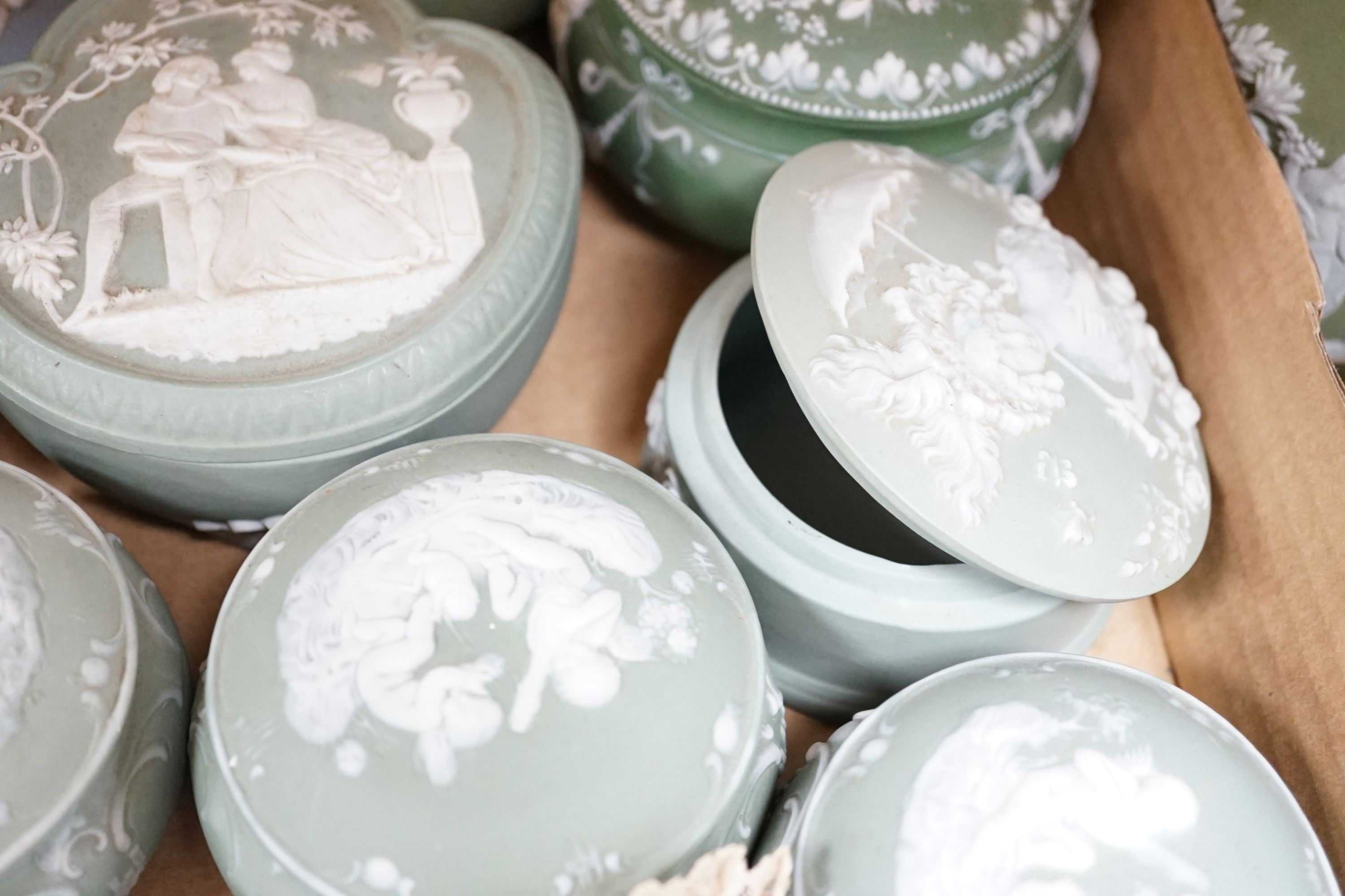 A collection of French bisque boxes and vases